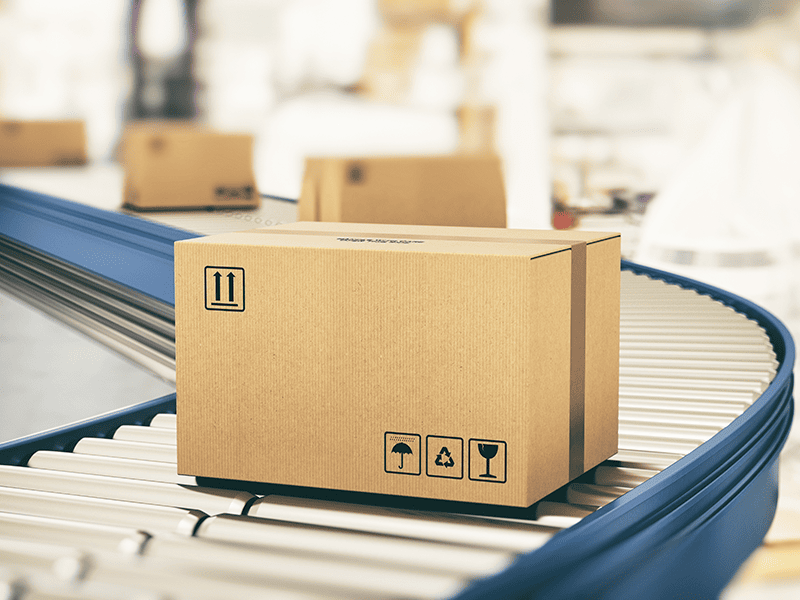 cardboard box on a curved conveyor belt