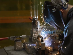 Industrial welding in a metal fabrication facility